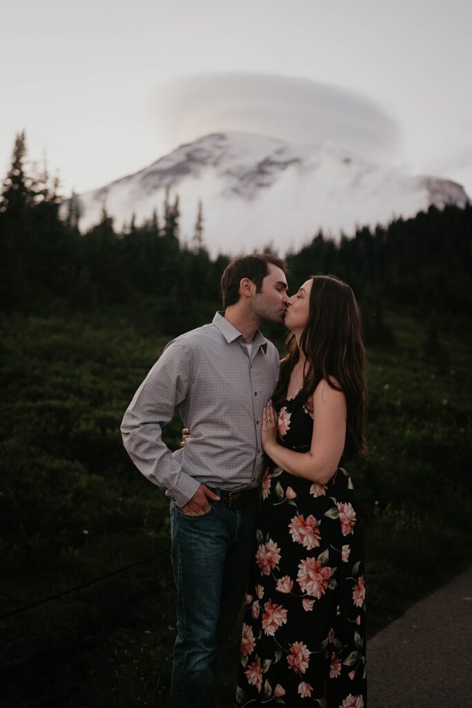 Couple kissing during sunset engagement photos at Mt Rainier