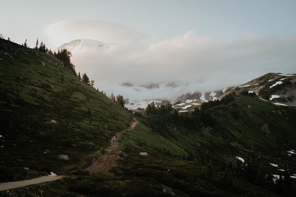 Couple kissing on a hiking trail in Paradise, Mt Rainier