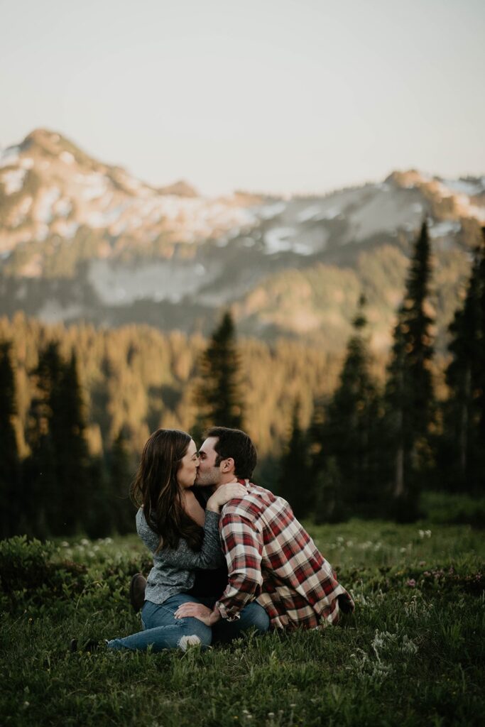 Couple kissing in the grass during Mt Rainier engagement photos