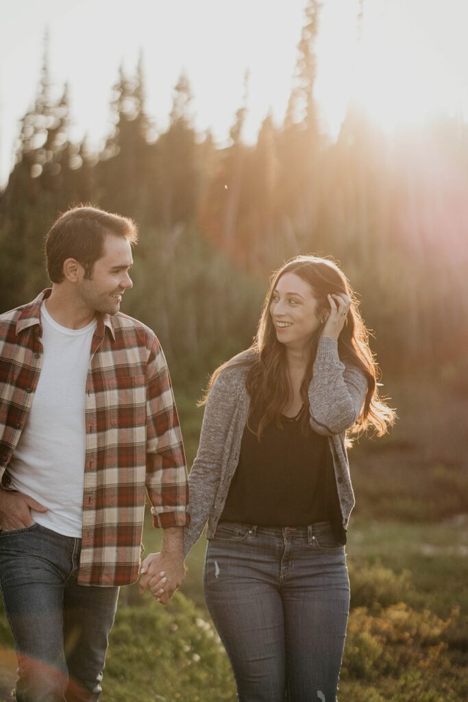 Couple holding hands during their Mt Rainier engagement photos