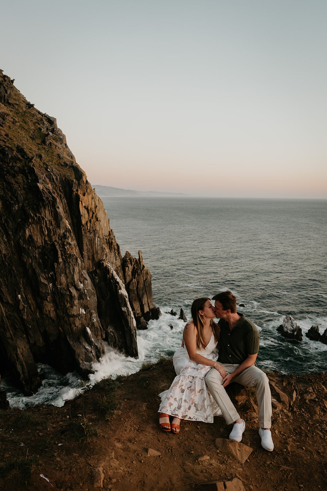 Couple kisses during their Oregon Coast engagement photo session