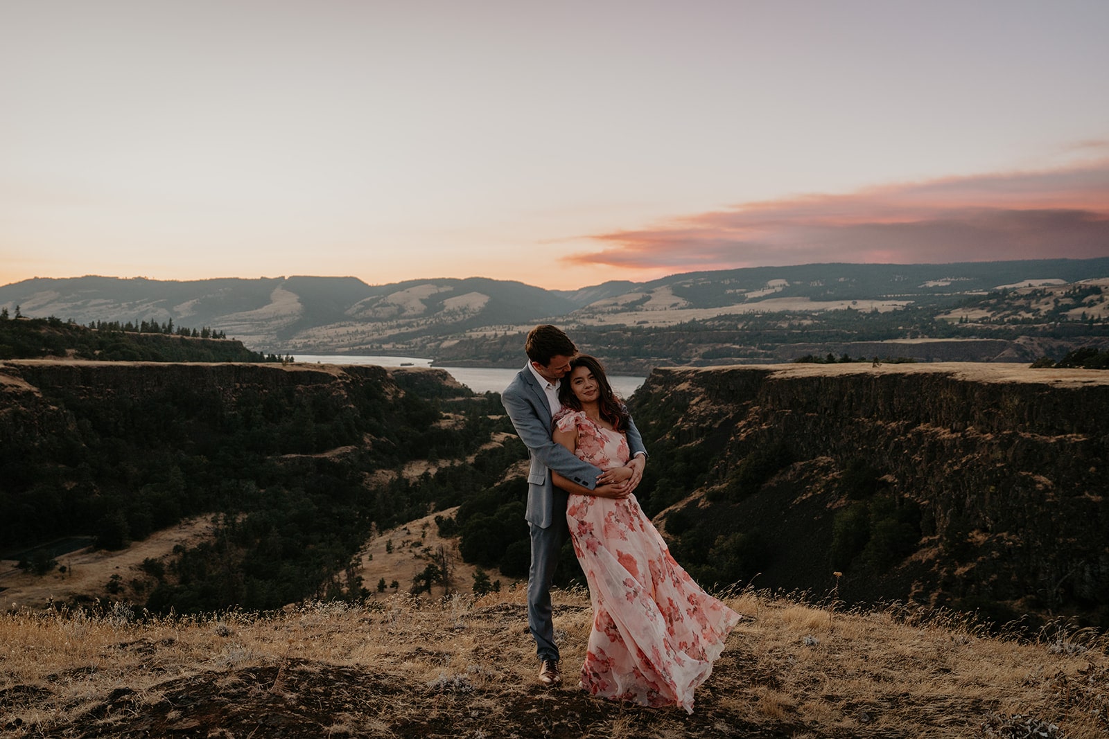 Couple hugs during their Oregon engagement photo session at Rowena Crest