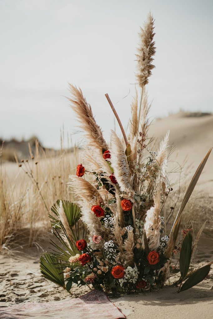 Orange, green and beige elopement florals at Oregon sand dunes elopement