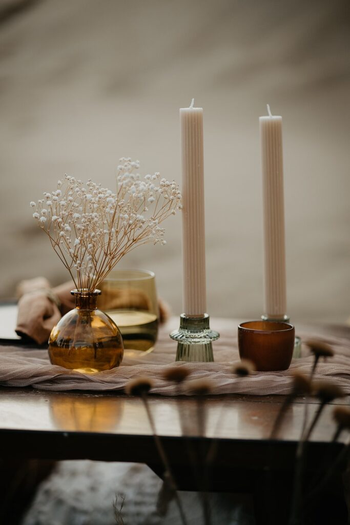 Beige and brown elopement details on reception table at Oregon sand dunes elopement