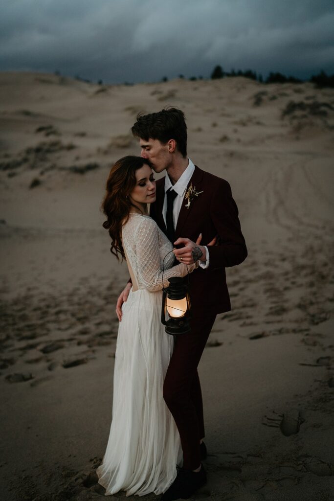 Bride and groom blue hour elopement photos on the sand dunes in Oregon