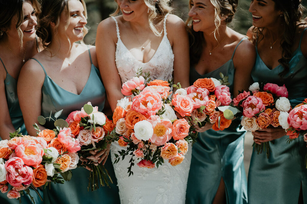 The rose bouquets of the bride and her bridesmaids. 