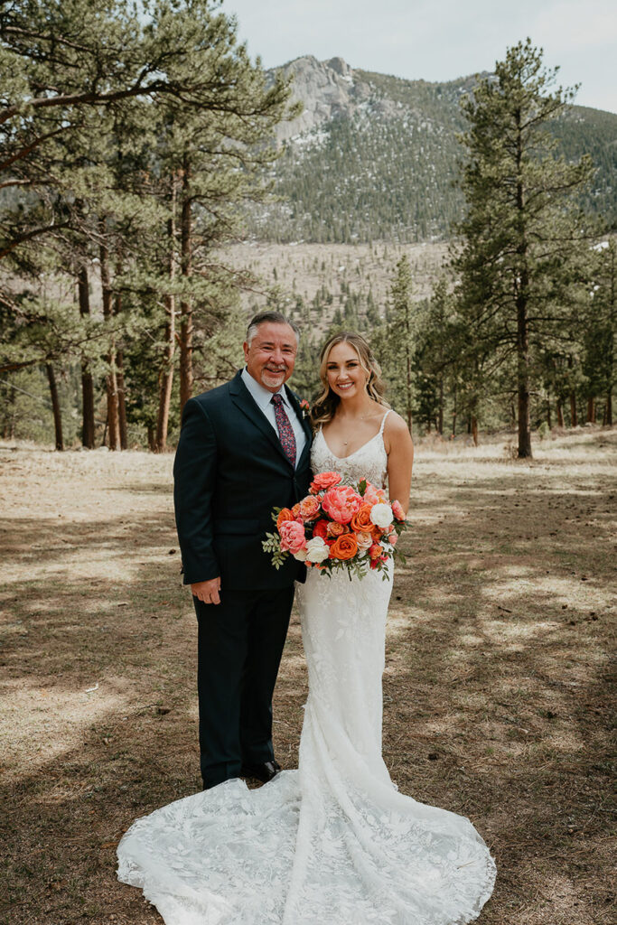 The bride with her father in the forest. 