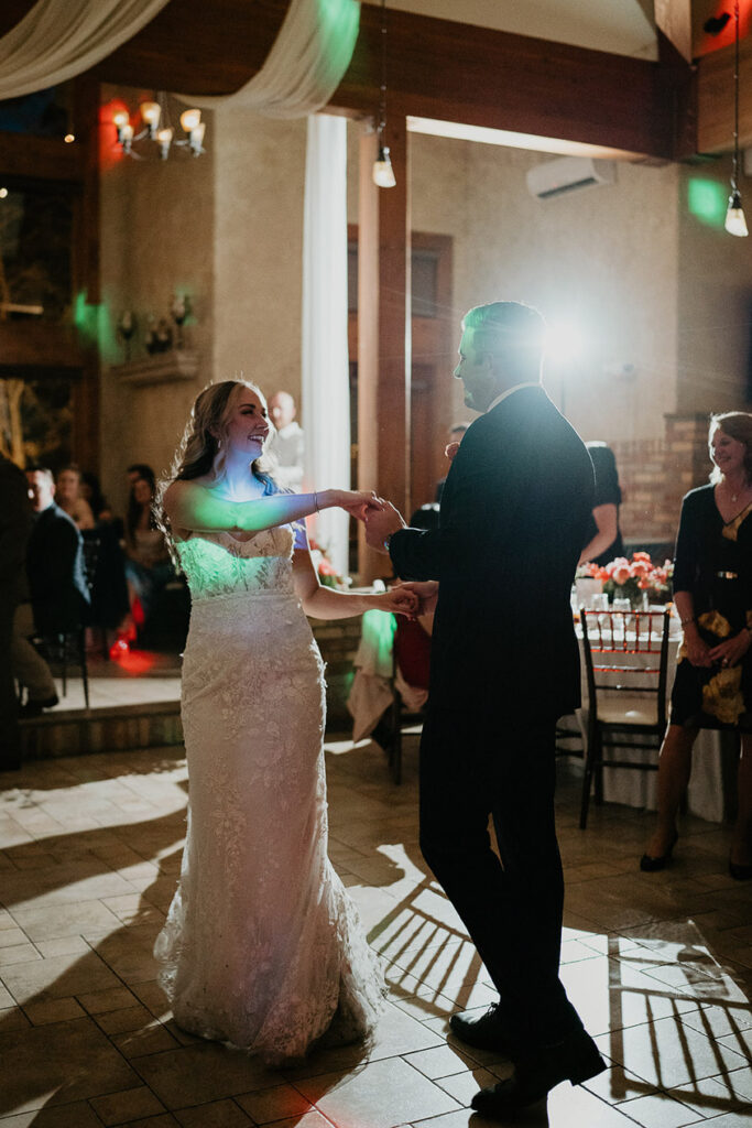 The bride and groom dancing. 