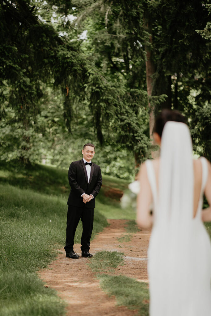 Joshua's first look after Judith turned around, with grass and trees in the background.