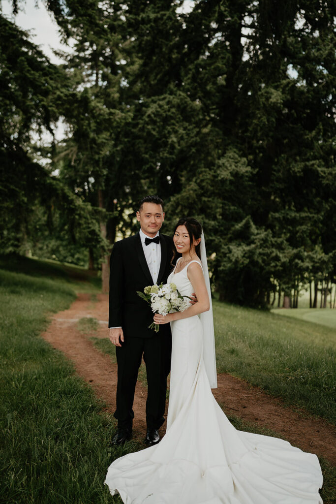 Joshua and Judith posing after their first look right before their Oregon Golf Club wedding. 