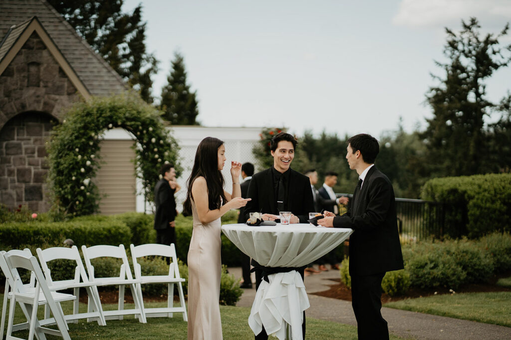 Wedding guests chatting during the cocktail hour after the Oregon Golf Club Wedding. 