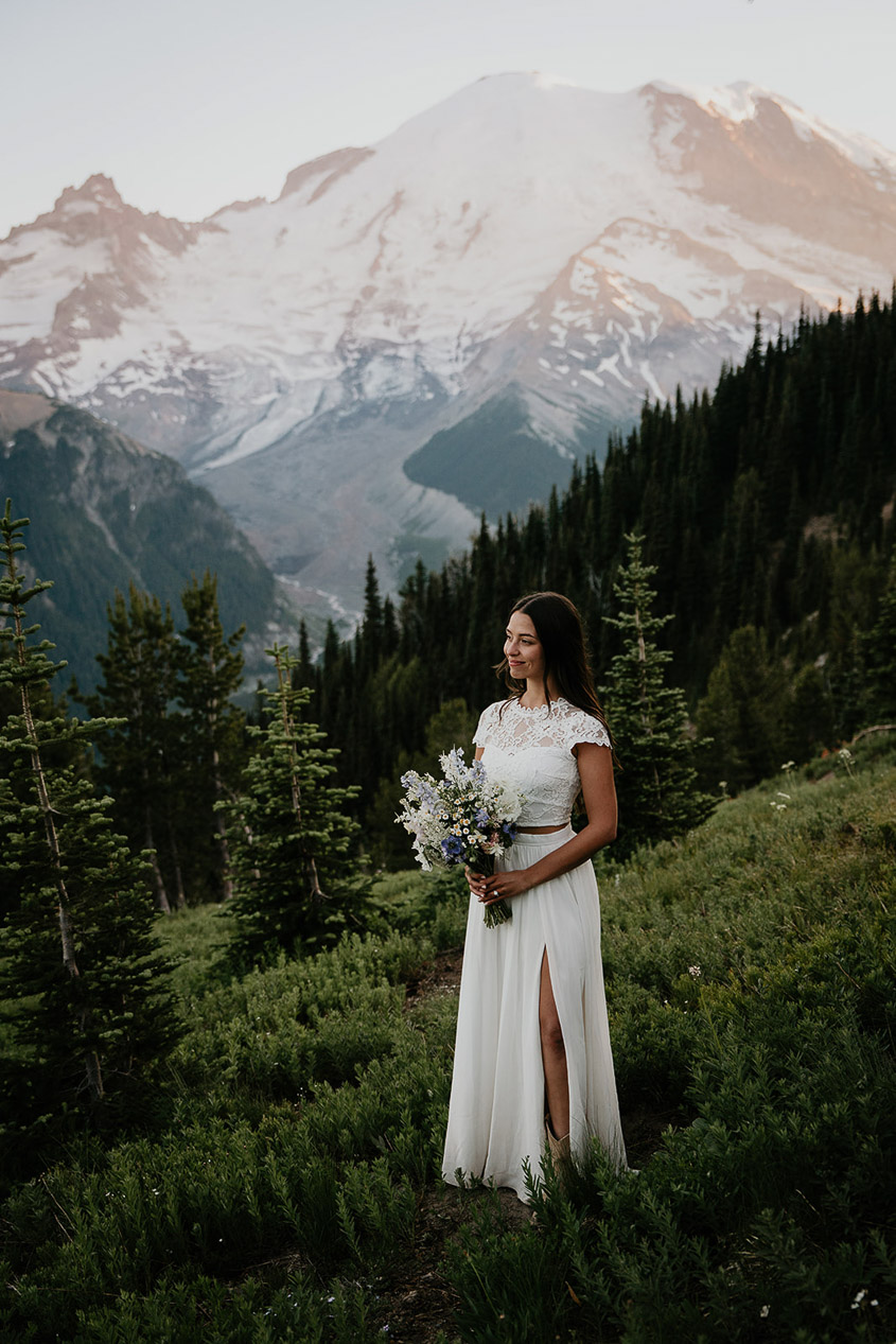 The wife posing with Mt Rainier in the background. 