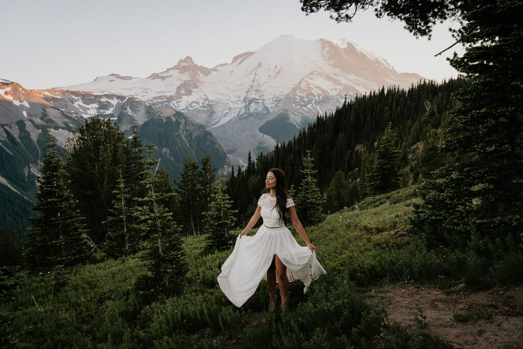 The wife posing with her flowers with Mt Rainier in the background. 