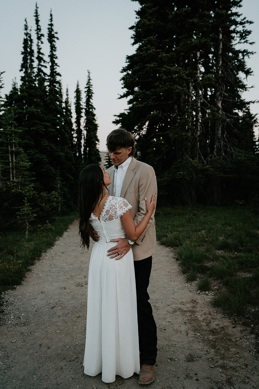 the husband and wife holding each other in the fading light. 