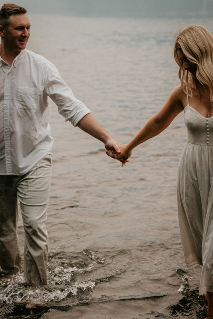 The couple holding hands in lost lake. 