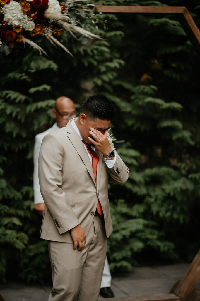 One of the brides trying to hold back tears. 