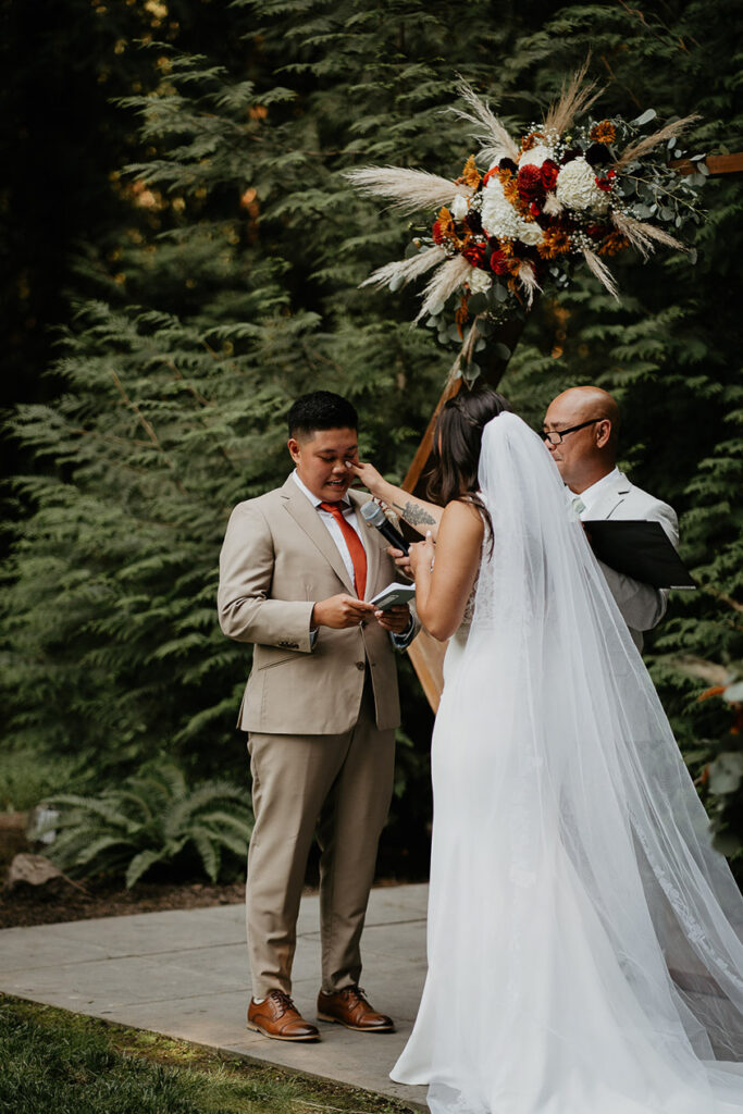 One of the brides reading her vows. 