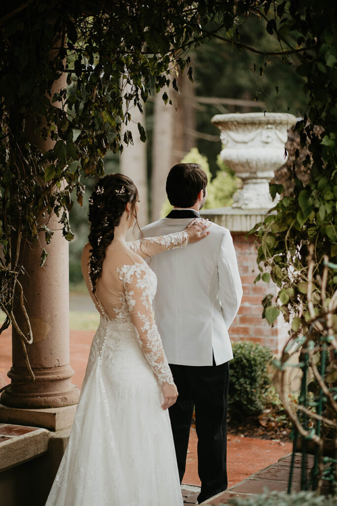 The bride tapping the shoulder of the groom in Lairmont Manor. 