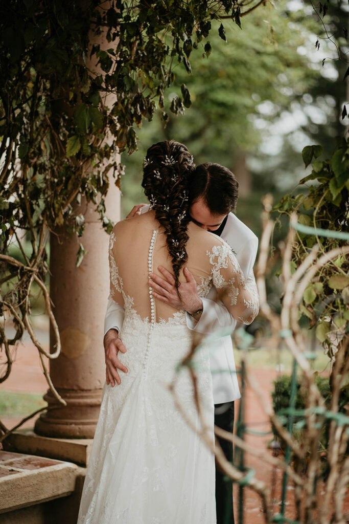 The groom hugging the bride after their first look. 