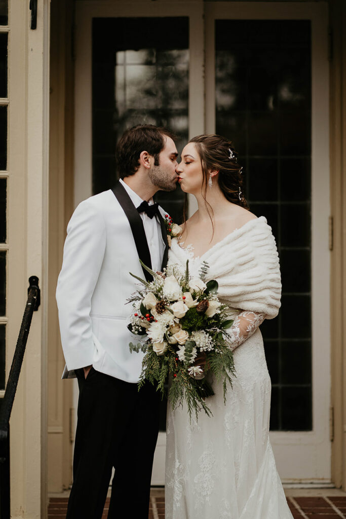 The bride and groom kissing at Lairmont Manor. 