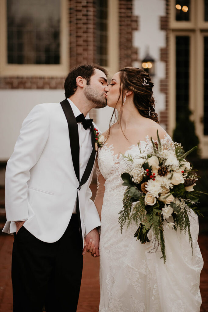 The bride and groom kissing at Lairmont Manor. 