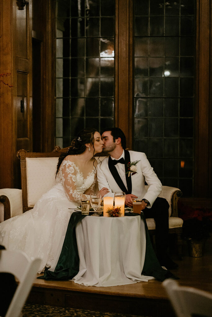 The newlyweds kissing. 