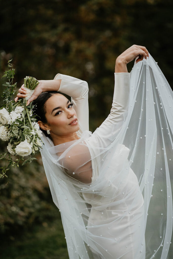 The bride showing off her veil. 