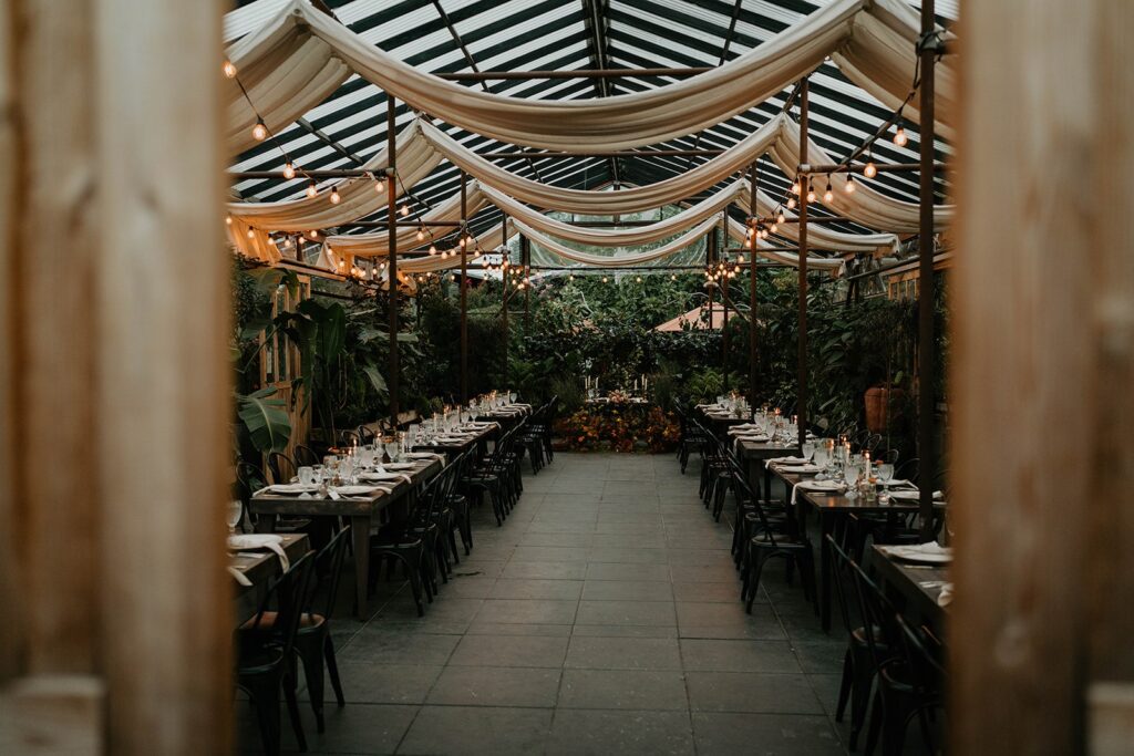 Reception tables with string lights at Blockhouse wedding venue in Oregon