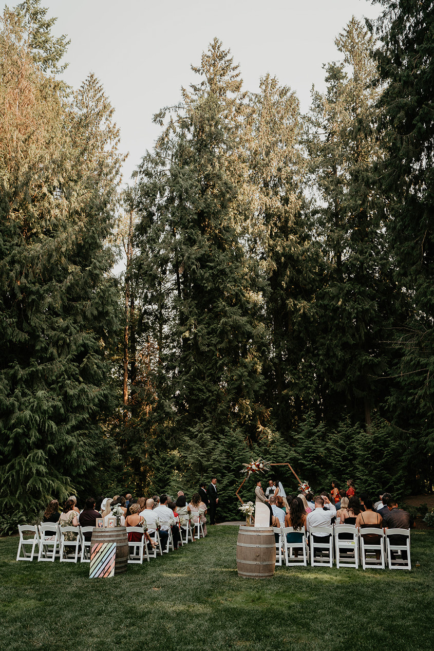 newlyweds getting married in a forest at CedarVale Events, one of the best venues in Oregon.