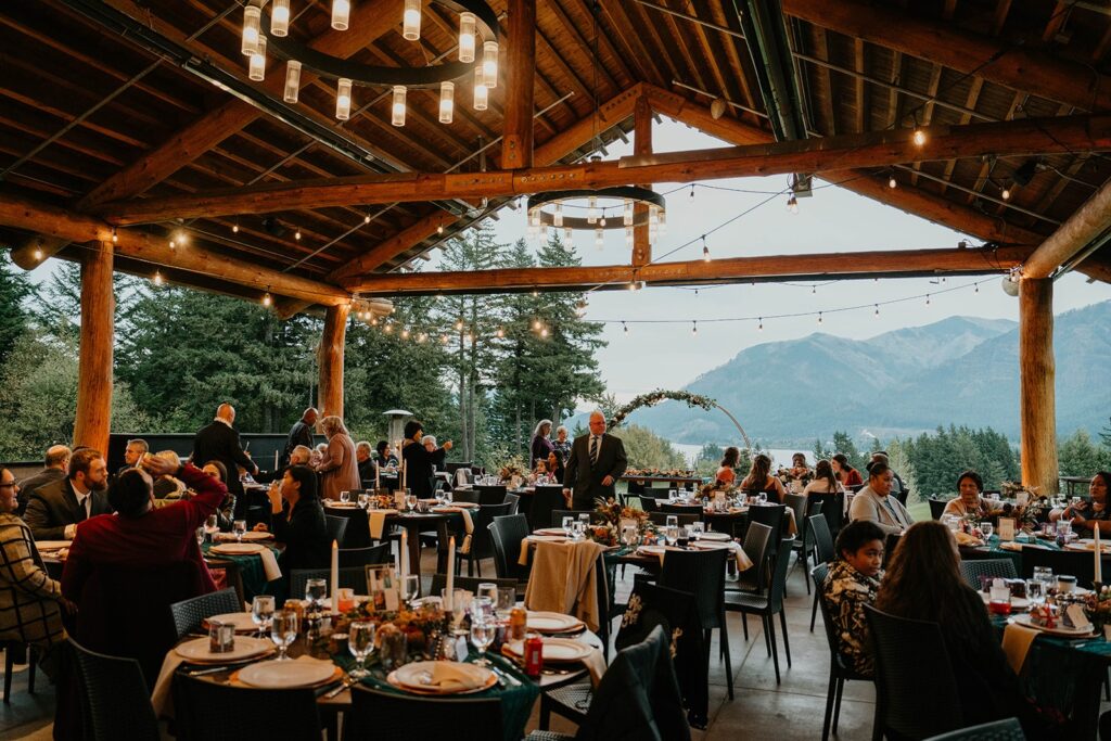 Guests dine at reception tables at Skamania Lodge wedding venue