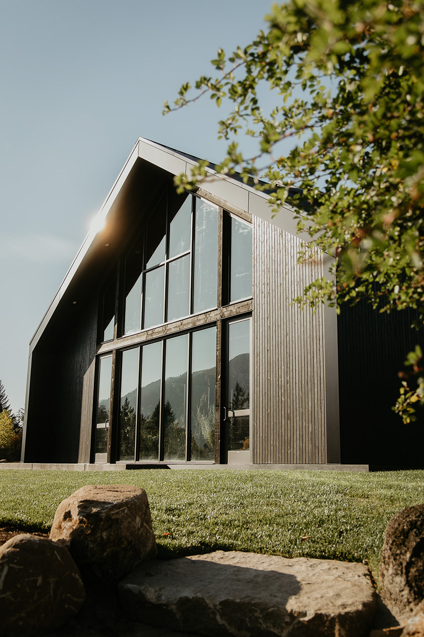 the outside of a building at Wind Mountain Ranch, one of the best wedding venues in Oregon.