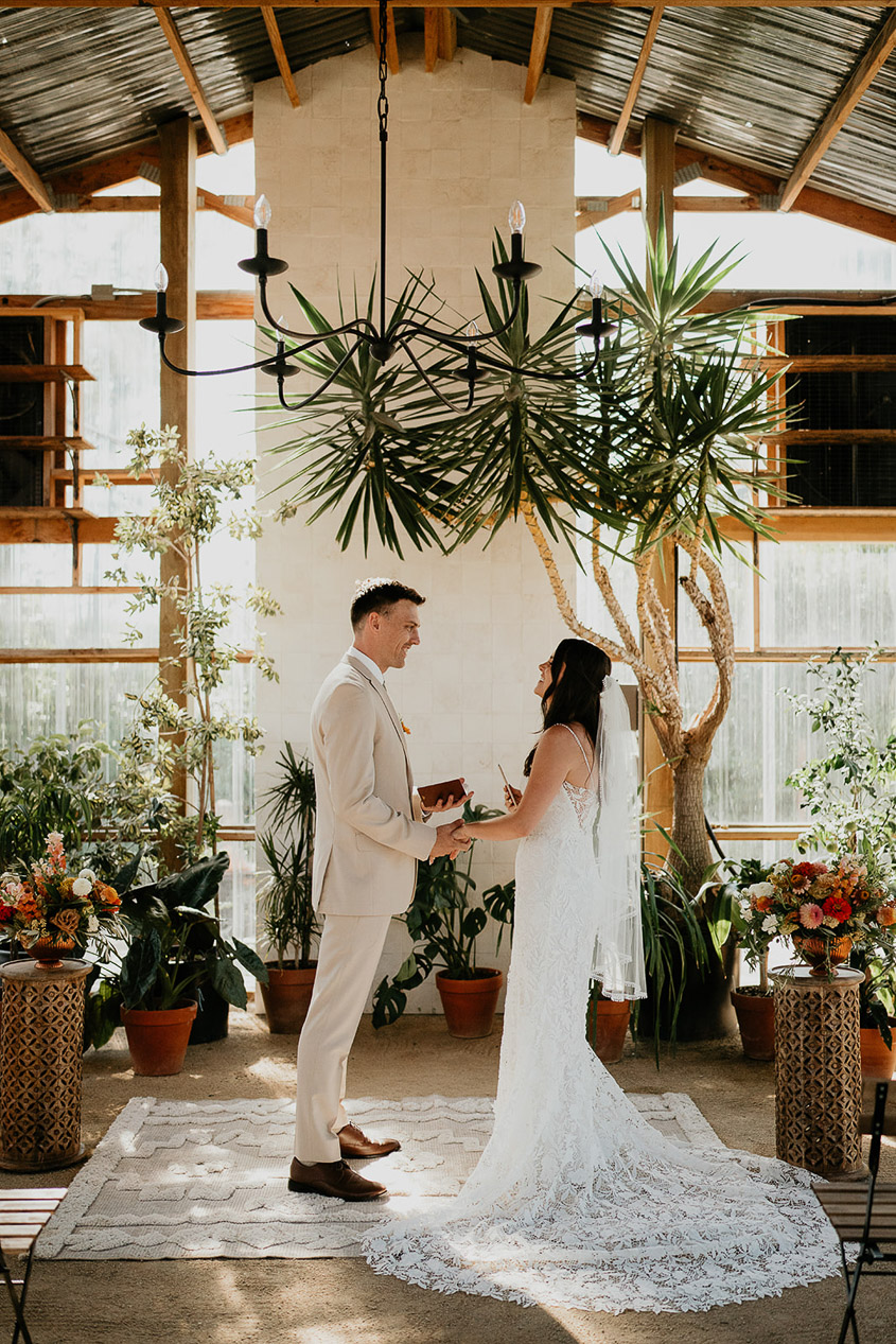 the bride and groom sharing their vows inside Mt Hood Center. 