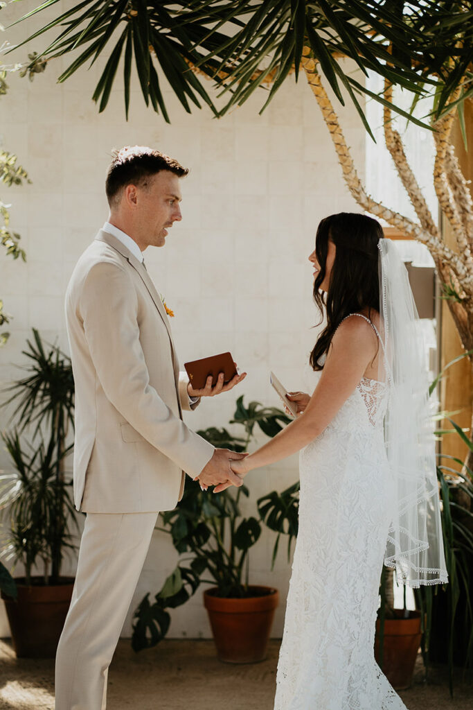 the bride and groom sharing their vows inside Mt Hood Center. 