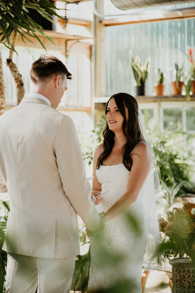 the bride and groom sharing their vows inside Mt Hood Center. 