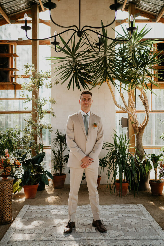 the groom posing inside Mt Hood Center. 