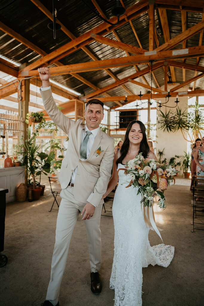 the newlyweds walking out of the Mt Hood Center. 