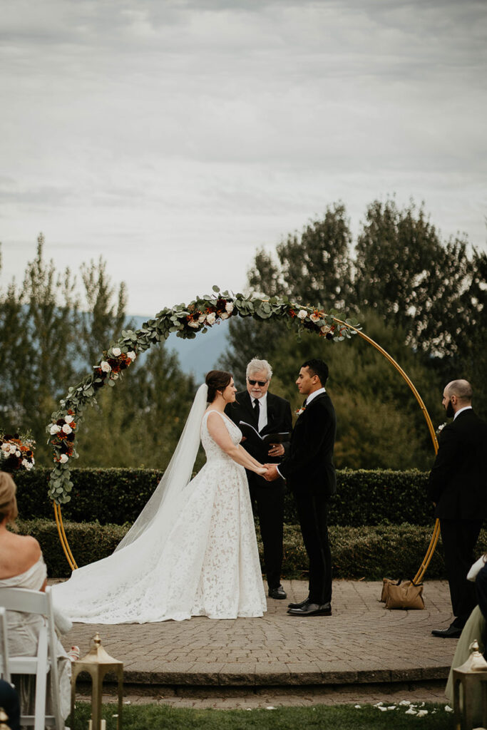 The bride and groom at the alter with the officiant at Skamania Lodge. 