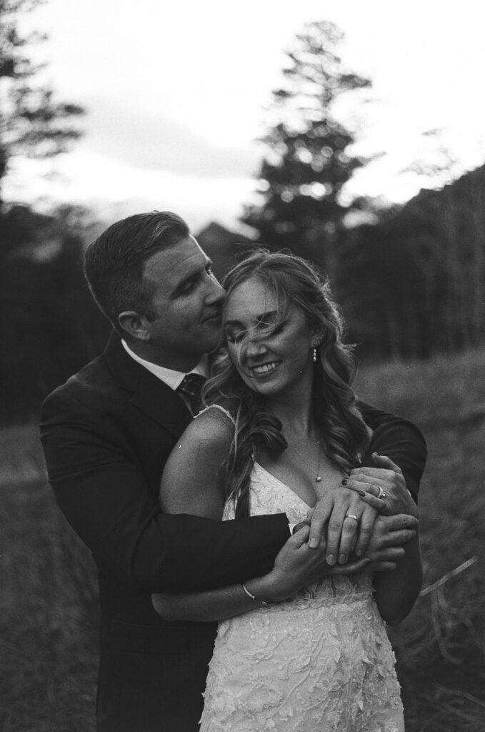 Bride and groom hug during their film wedding photo session