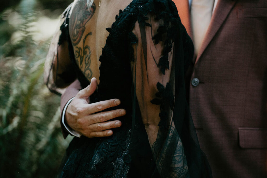 A close-up of the husband holding his new wife. 