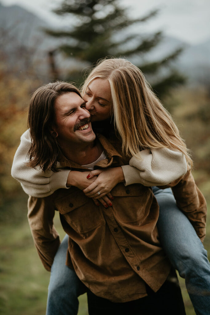 a newly engaged couple holding each other in the Columbia River Gorge. 