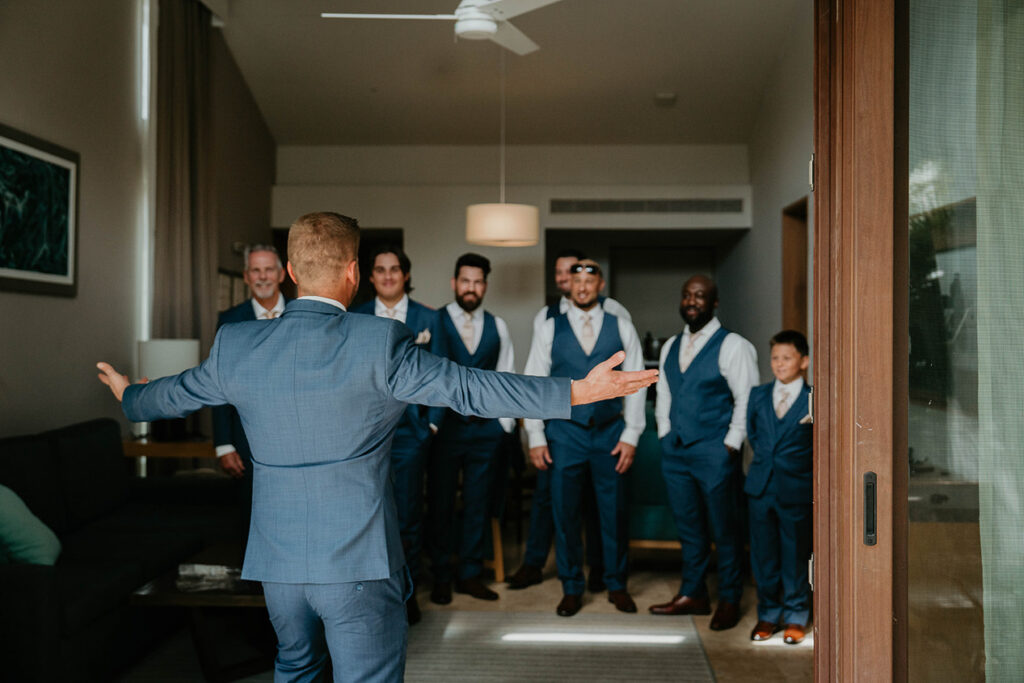 The groom welcoming his groomsmen. 