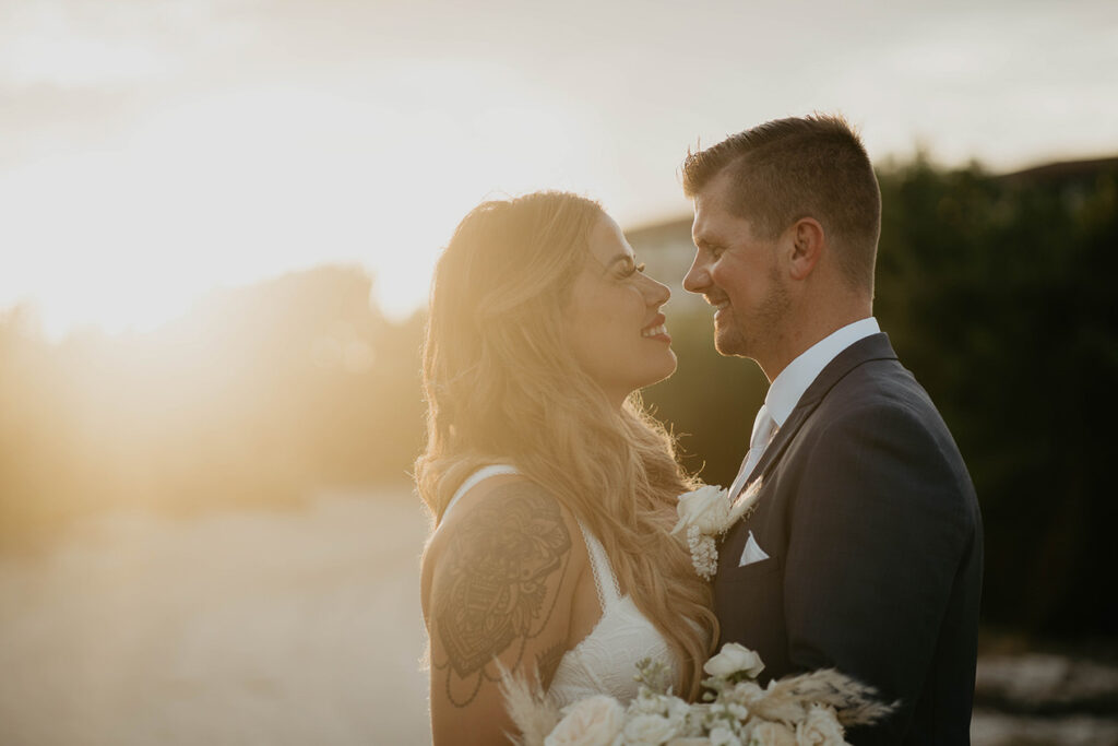 The newlyweds staring into each other's eyes during their Mexico destination wedding. 