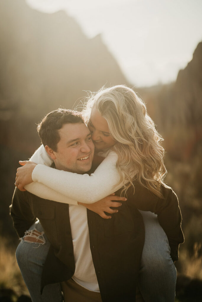 the boyfriend carrying his fiancée during their Smith Rock Engagement session. 