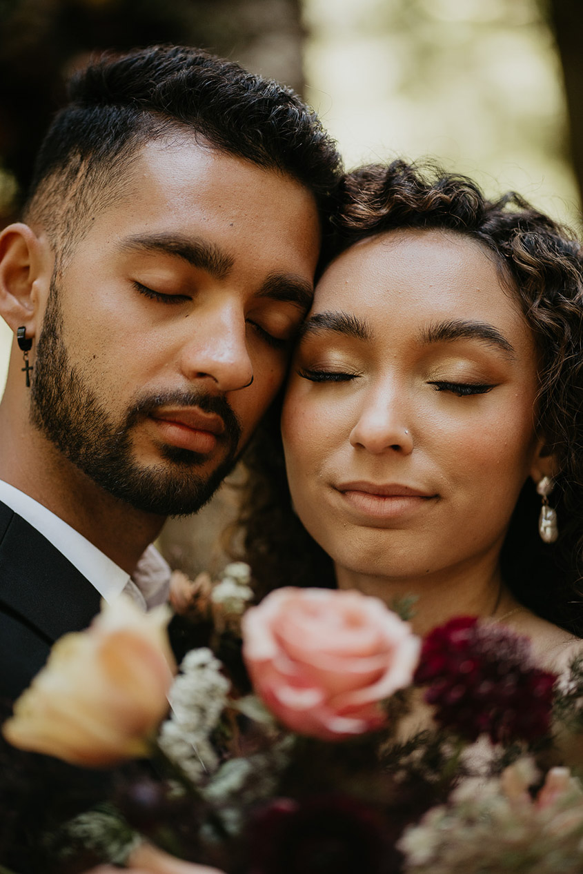 The bride and groom's faces touching. 