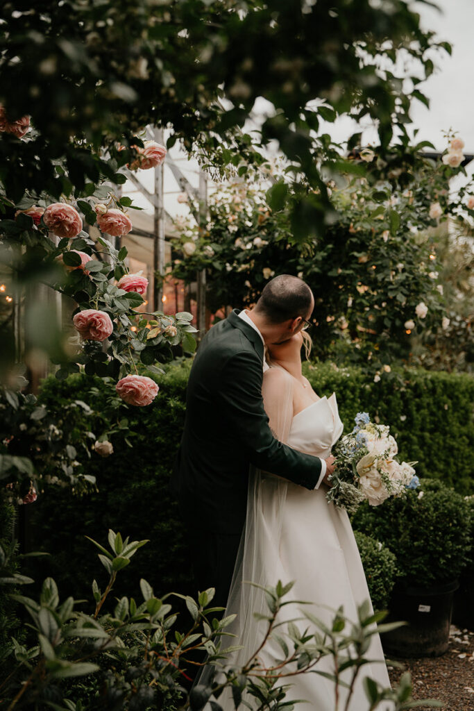 the newlyweds kissing during their Blockhouse PDX wedding. 