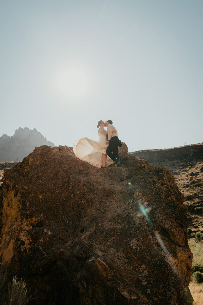 A couple after finishing a boulder problem as they elope in Smith Rock.