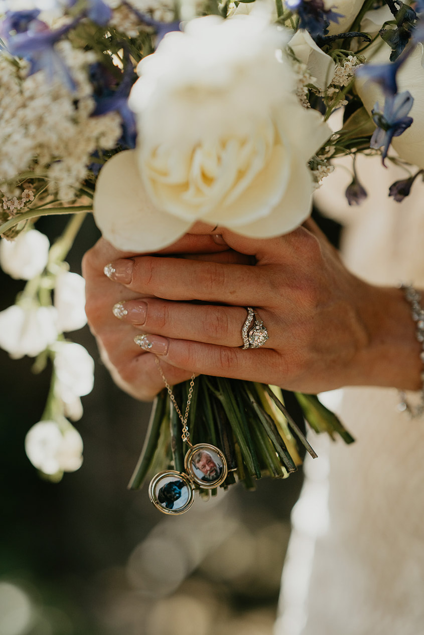 a close up of the bride's wedding ring and bouquet. 