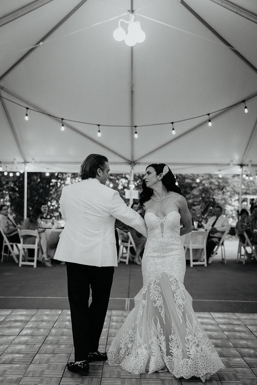 the bride and groom dancing during their first dance. 