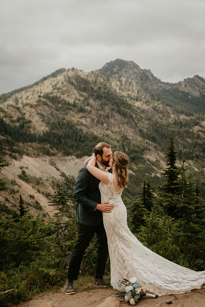 A couple hugging during their elopement in Mt Rainier National Park.