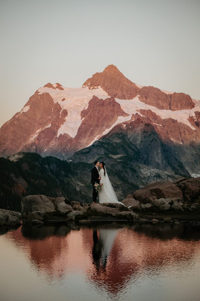 Bride and groom kiss by the lake at Artist Point during their North Cascades elopement